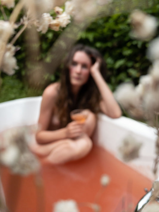 A woman soaking in a bath.